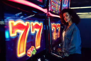 A cheerful woman in traditional clothing using her smartphone during a festive moment, showing how easily the B86BET app fits into everyday life.