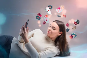 A close-up shot of golden coins falling around a spinning roulette wheel, representing immersive casino action at B86BET.