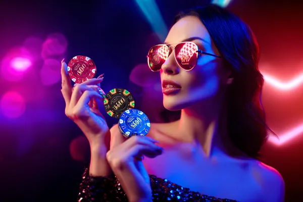B86BET Mobile Casino — Play anytime, anywhere A player using their smartphone during a festive local event, representing B86BET’s fully mobile-friendly casino.